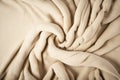 Beige woven textile drape background. Waving cloth fabric canvas