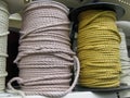 Beige and yellow ropes on coils.