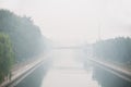 Beijing air pollution seen from a bridge overlooking a canal Royalty Free Stock Photo