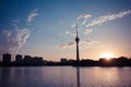 Beijing central tower silhouette with buildings in the background of a river at Sunset