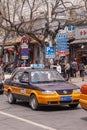 Mauve-orange taxi stuck in traffic, Beijing, China