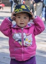 Closeup of very young boy with pink vest, Beijing.