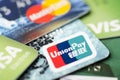 Beijing, China - April 6, 2019: UnionPay, Visa and MasterCard cards close-up, soft focus