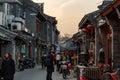 BEIJING, CHINA - DEC 24, 2017: Tourists and locals walking on hutong traditional street of Beijing Royalty Free Stock Photo