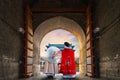 A Chinese girl with her mother in traditional winter dress at Qianmen Gate in Beijing, China