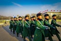 BEIJING, CHINA - 29 JANUARY, 2017: Chinese army soldiers marching on Tianmen square wearing green uniform coats and