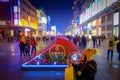 BEIJING, CHINA - 29 JANUARY, 2017: Walking on the famous pedestrian shopping street Wangfujing on a dark evening, busy Royalty Free Stock Photo
