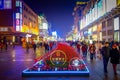 BEIJING, CHINA - 29 JANUARY, 2017: Walking on the famous pedestrian shopping street Wangfujing on a dark evening, busy Royalty Free Stock Photo