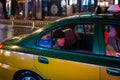 Passenger taking a ride on a Beijing city Taxi on a rainy night in China Royalty Free Stock Photo