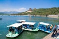 Tourists enjoy a cruise in pedal boats on the Kunming Lake in the Summer Palace in Beijing, China.