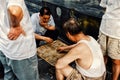 People playing typical xiangqi chinese chess on the street in a traditional chinese city hutong Royalty Free Stock Photo