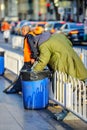 BEIJING, CHINA - MARCH 11, 2016: Homeless in a garbage box looking for food.