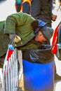 BEIJING, CHINA - MARCH 11, 2016: Homeless in a garbage box looking for food.