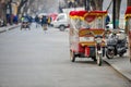 BEIJING, CHINA - MARCH 12, 2016: Tourists in a rickshaw in a hut Royalty Free Stock Photo