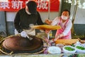 Steet vendors making pancekes, Beijing, China