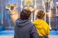 Beijing, China, October 16, 2018: Dad and son are watching the skeletons of ancient and modern people. Human evolution