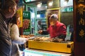 Beijing, China - OCTOBER 27 2019: Street food at night close to Qianmen street, people buying food in Beijing Royalty Free Stock Photo