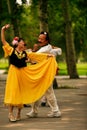 Beijing, China 07.06.2018 Woman in yellow dress and man dance in the park