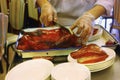 Beijing duck meat being cut off bones