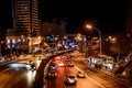 Beijing at night, driving cars on a busy road in the city