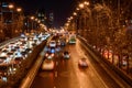 Beijing at night, driving cars on a busy road in the city