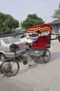 Beijing, 7th may: Tricycle with red cab from the Wangzuo Hutong in Beijing Royalty Free Stock Photo