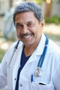 Being a doctor is so fulfilling. Cropped portrait of a male doctor smiling happily outside. Royalty Free Stock Photo