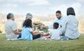 Being a family means you are a part of something. family praying outside.