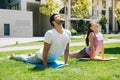 Pleasant young couple doing gymnastics