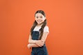 Being great every day. Fashion baby girl. Cute little fashion model on orange background. Small child with fashion look Royalty Free Stock Photo