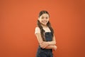 Being great every day. Fashion baby girl. Cute little fashion model on orange background. Small child with fashion look Royalty Free Stock Photo