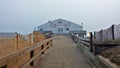 Historic Kitty Hawk Pier in Fog on the North Carolina Outer Banks Royalty Free Stock Photo