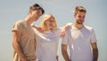 Being together. group of people outdoor. heaven concept. success heights. happy woman and two men. cheerful friends Royalty Free Stock Photo