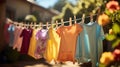 After being washed, childrens colorful clothing dries on a clothesline in the yard outside in the sunlight. Generative AI