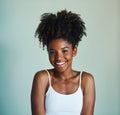 Being you is the best thing you can do. Studio shot of a beautiful, fresh faced young woman posing against a green