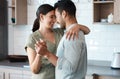 Being with you brings me so much peace. Shot of a young couple dancing in the kitchen at home. Royalty Free Stock Photo