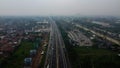 Aerial drone view of highway multilevel junction road with moving cars after rainy. Cars are blurred Royalty Free Stock Photo