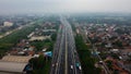 Aerial drone view of highway multilevel junction road with moving cars after rainy. Cars are blurred