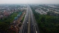 Aerial drone view of highway multilevel junction road with moving cars after rainy. Cars are blurred