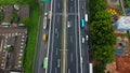 Aerial drone view of highway multilevel junction road with moving cars after rainy. Cars are blurred Royalty Free Stock Photo