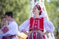 A beautiful girl in a Belarusian national costume is dancing Royalty Free Stock Photo
