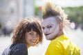 Guy punk with a beautiful girl on a city street