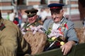 Holiday Victory Day. Central Park.A veteran of the second world war with flowers