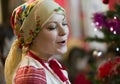 Slavic girl in a scarf sings a song