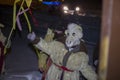 A man in a goat costume performs a ritual of caroling