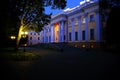 A beautiful palace in the evening park.