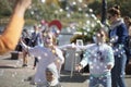 Joyful children in the street catch soap bubbles Royalty Free Stock Photo