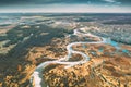 Belarus, Europe. Aerial View Curved River And Small Town In Early Spring Landscape. River bends Curves and dry grass