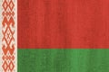 Belarus flag on wooden surface. Belarussian national flag on wooden texture