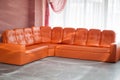 Hall with an orange sofa. Royalty Free Stock Photo